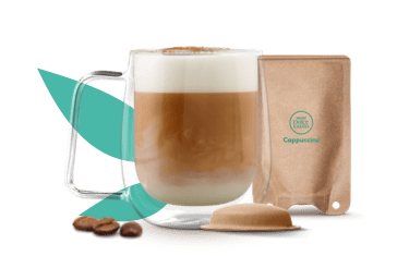 mok met cappuccino naast een NEO pad en sachet