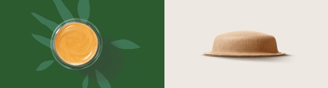 branche avec des feuilles à côté d'une tasse, d'une capsule et d'un sachet