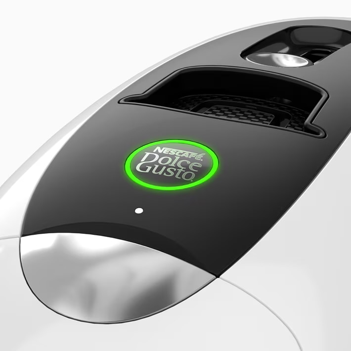 Witte NEO Latte koffiemachine met groen verlichte startknop.